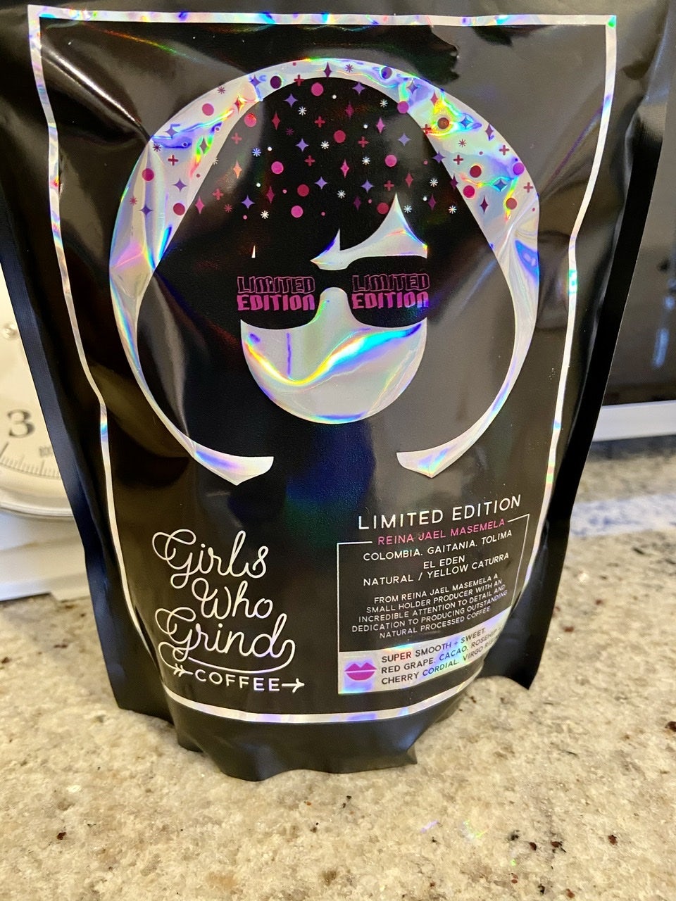 Coffee packaging with mirror foiling that has rainbow colours because of the light