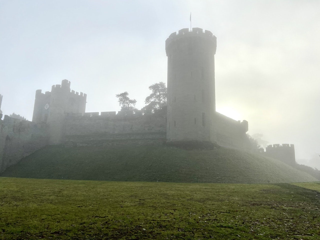 The castle with lots of fog and a clearing sky