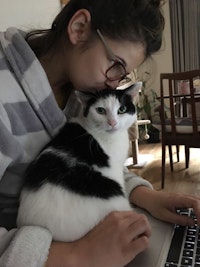 Jessie sits with Ana while she works on her laptop